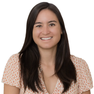 Woman with long dark hair and brown eyes wearing a red and white blouse.