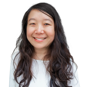 Asian woman with long dark wavy hair wearing a white shirt.