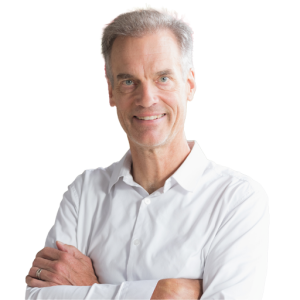 Mature white man with short gray hair wearing a white button down shirt.