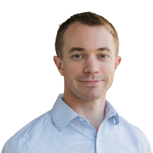 white man with short blond hair and wearing a light blue button down shirt.