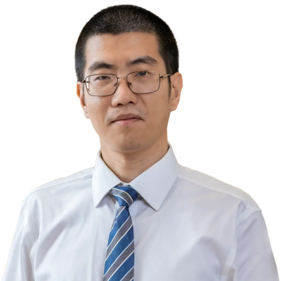 Asian man with black hair who is wearing glasses and a tie.