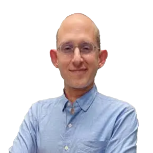 White man with no hair wearing glasses and a light blue button down shirt.