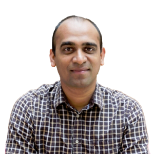 Middle eastern man with minimal dark hair wearing a plaid button down shirt.