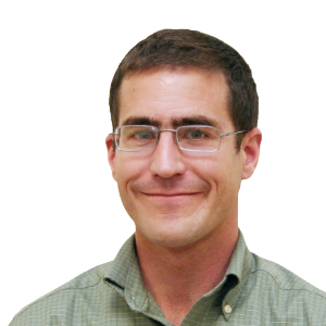 white man with short brown hair wearing glasses and a light green button down shirt.