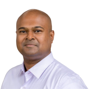 Black man with no hair wearing a white button down shirt.