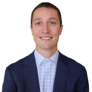 White man with short dark brown hair wearing a black suit jacket over a light blue button down shirt.