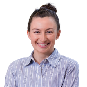 White woman with dark brown hair in a pony tail wearing a blue striped button down shirt.