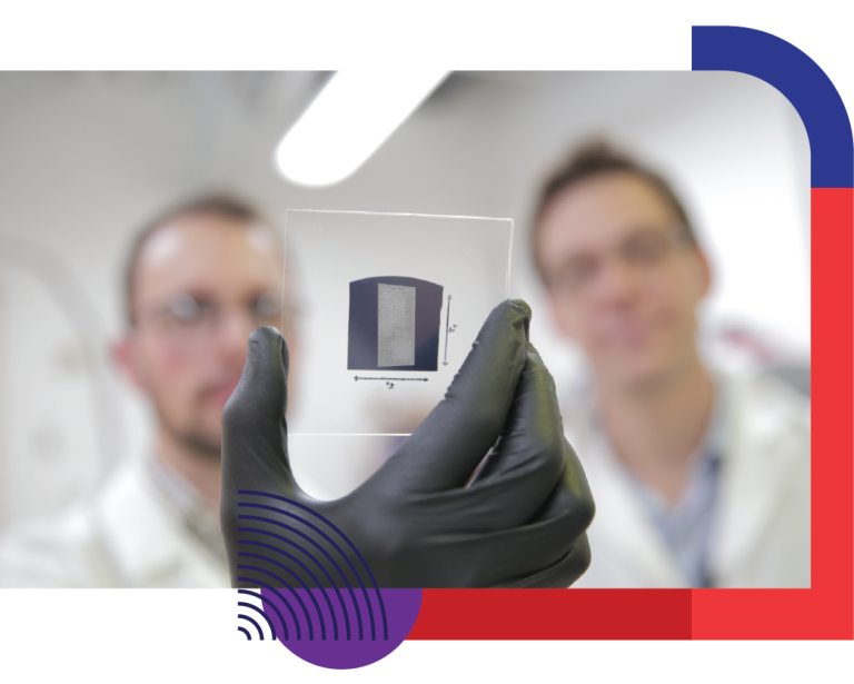 Researchers holding a close-up of nanotubes in a lab