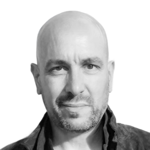 Headshot of a white man with a shaved head.